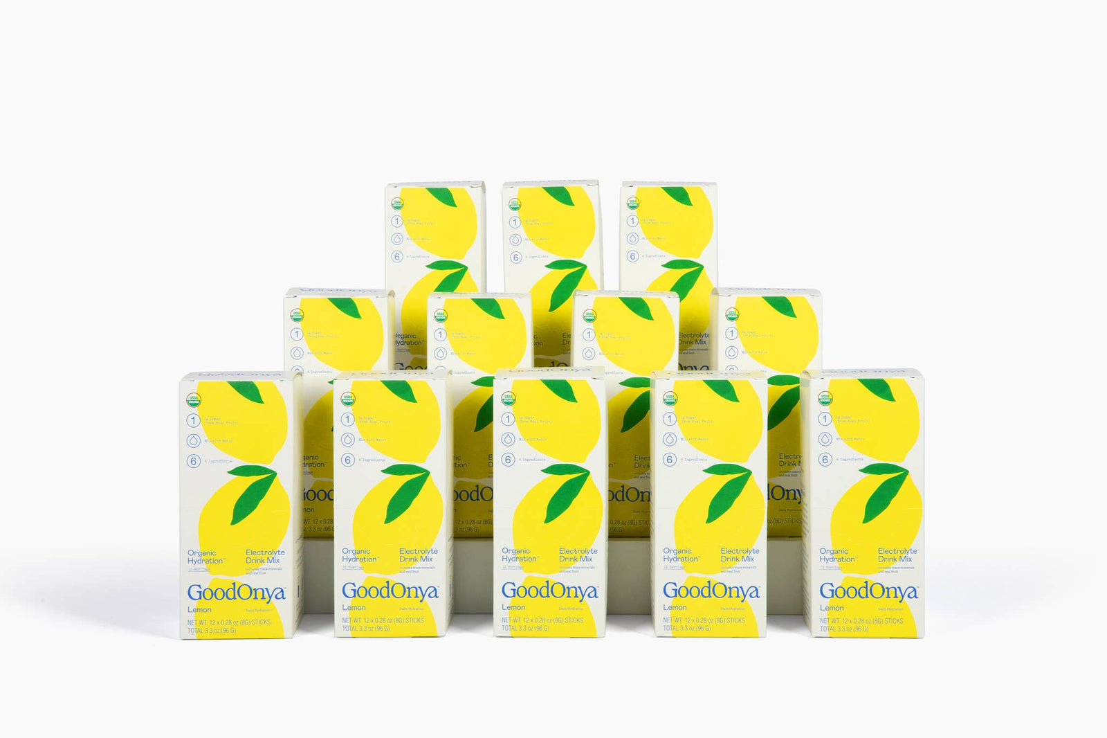 Multiple boxes of GoodOnya lemon-flavored snack bars on a white background