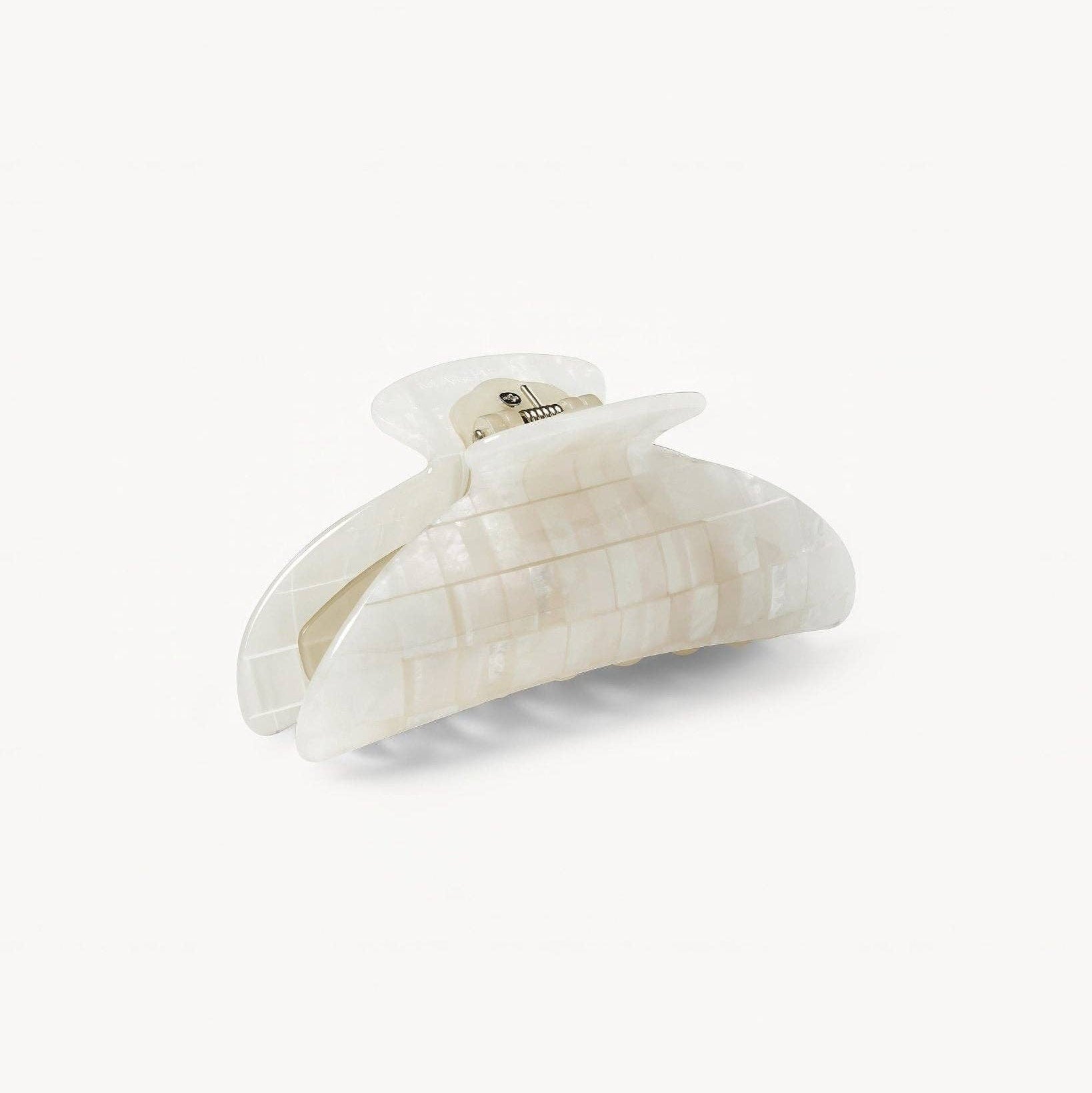 Decorative wall hook with a textured surface on a white background