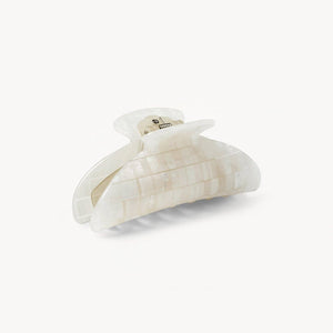 White hair clip on a white background