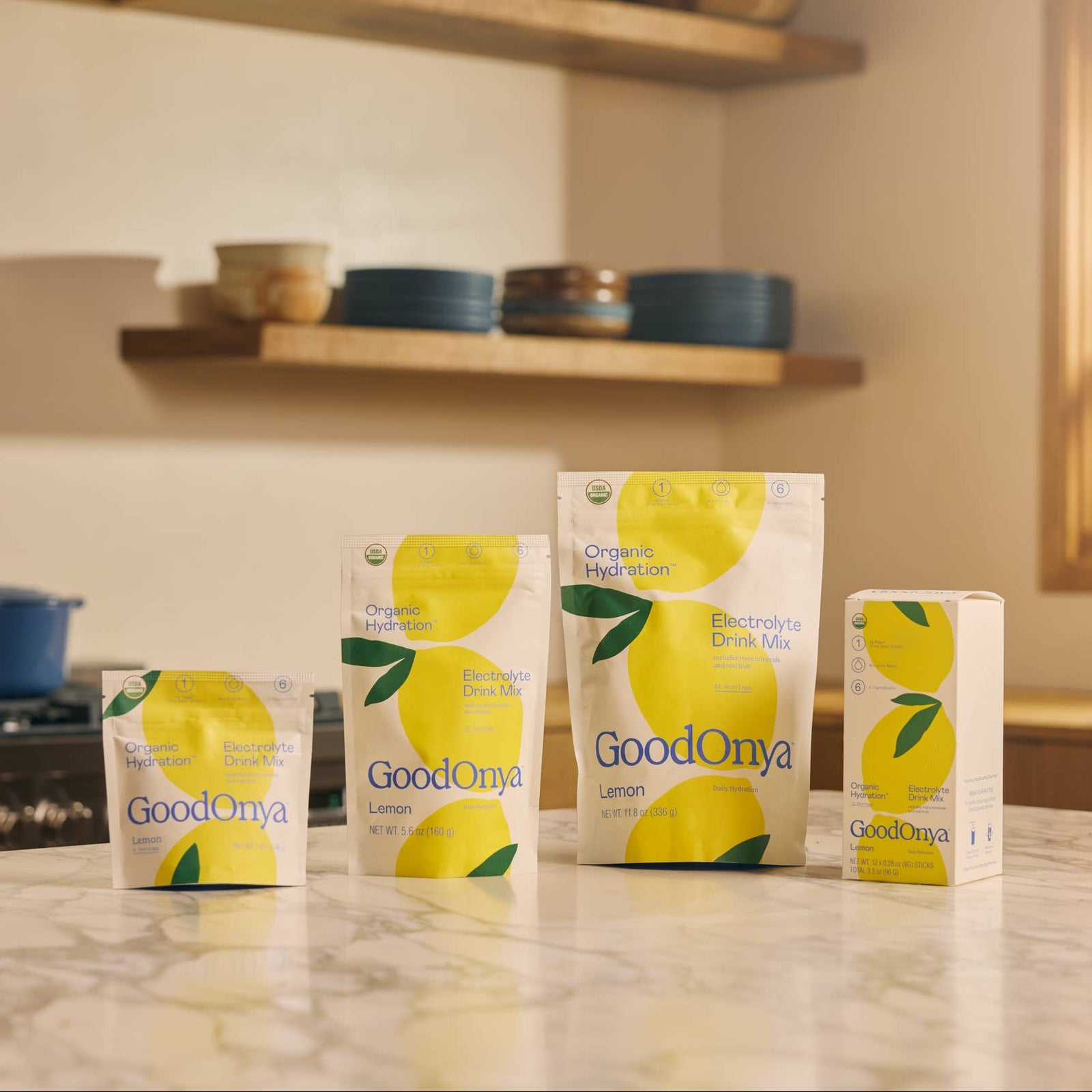 Multiple boxes of GoodOnya lemon-flavored snack bars on a white background