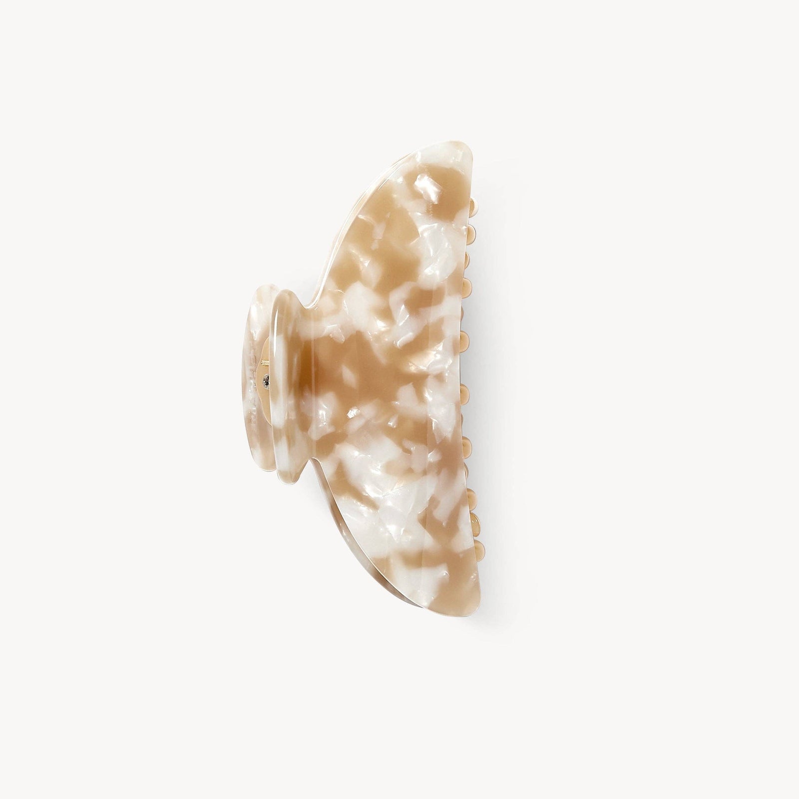 Marble-patterned hair clip on a white background