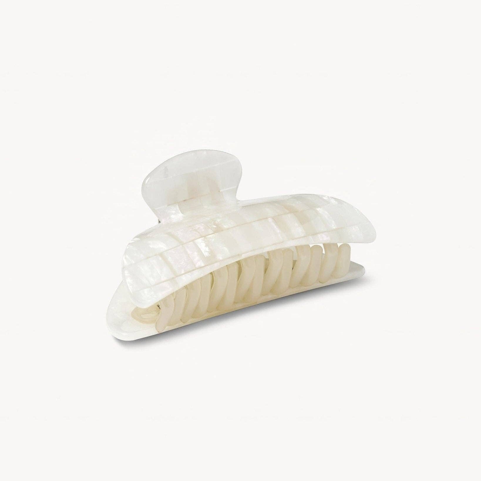 Clear plastic hair clip on a white background