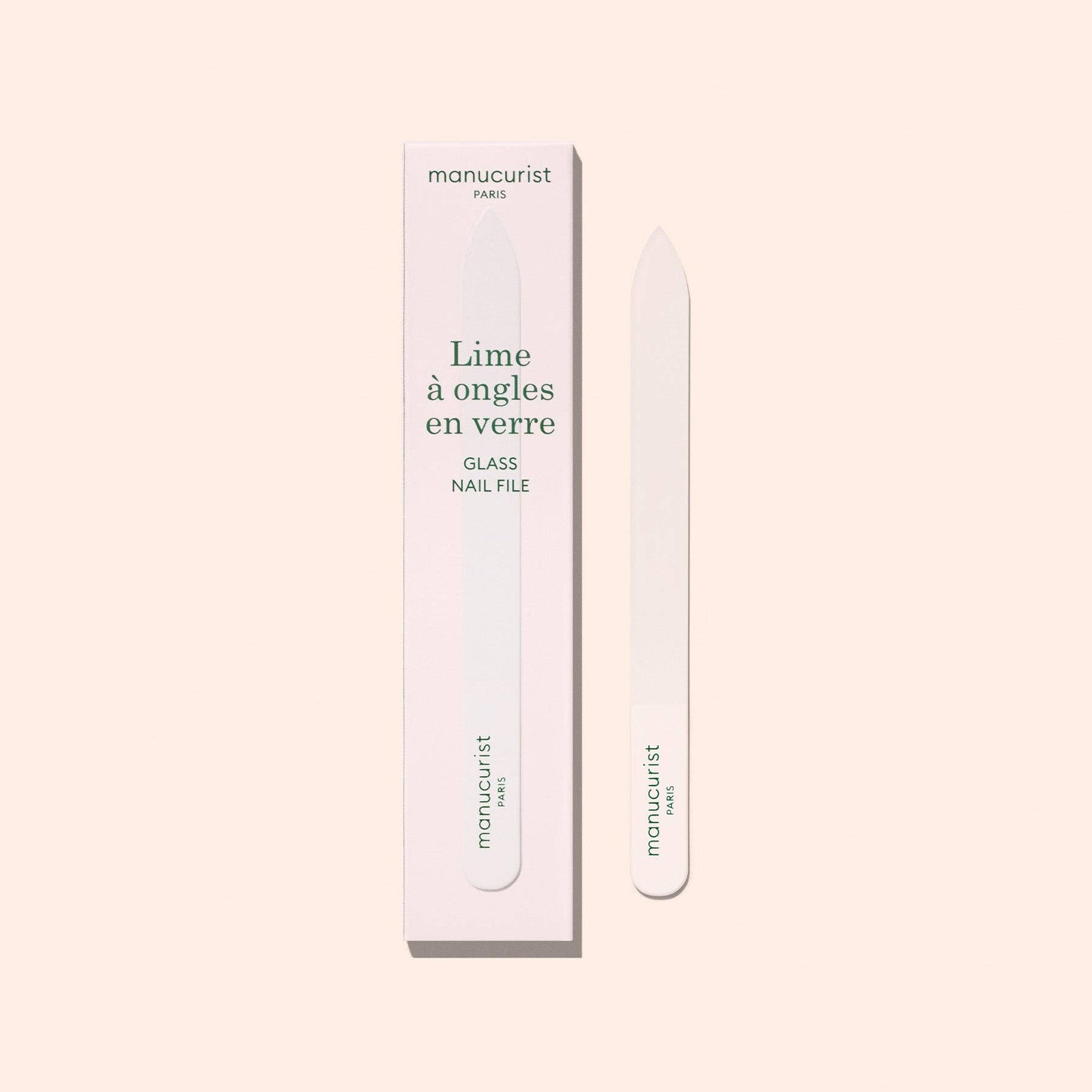 Manucurist glass nail file with packaging on a light beige background
