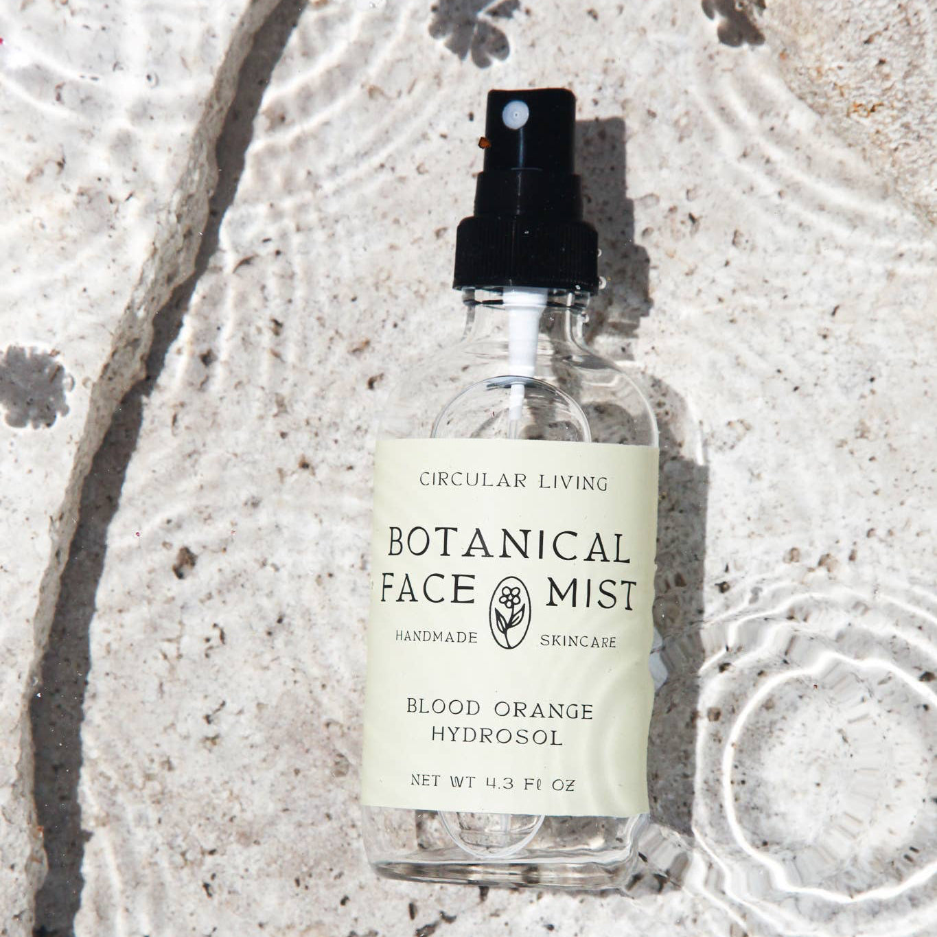 Bottle of Botanical Face Mist with a beige label on a light background