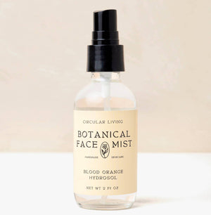 Botanical Face Mist bottle with label on a beige background