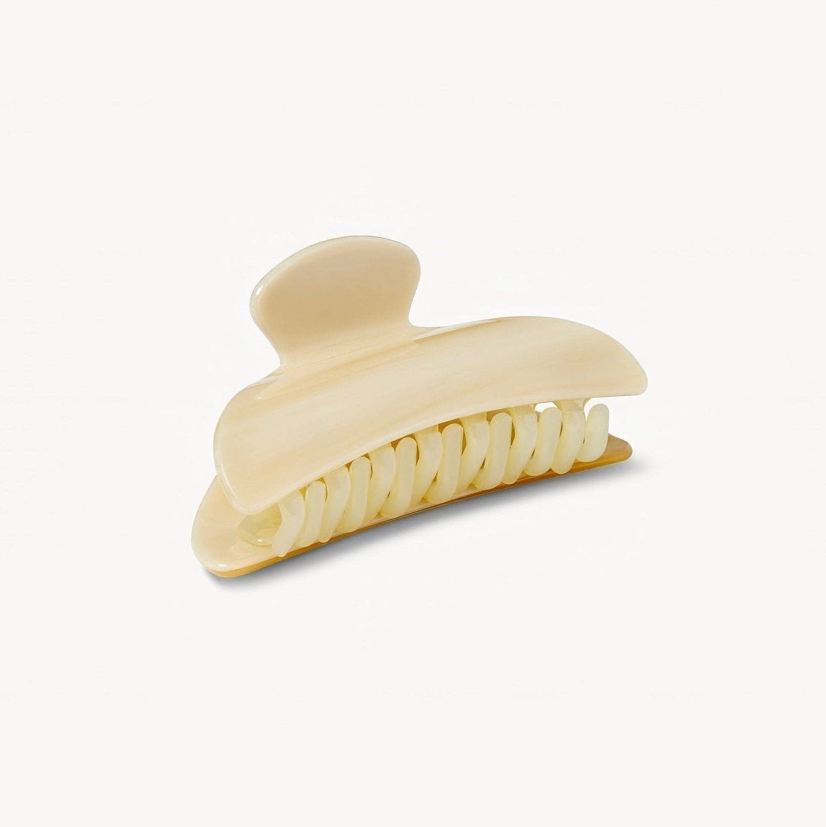 Beige hair clip on a white background