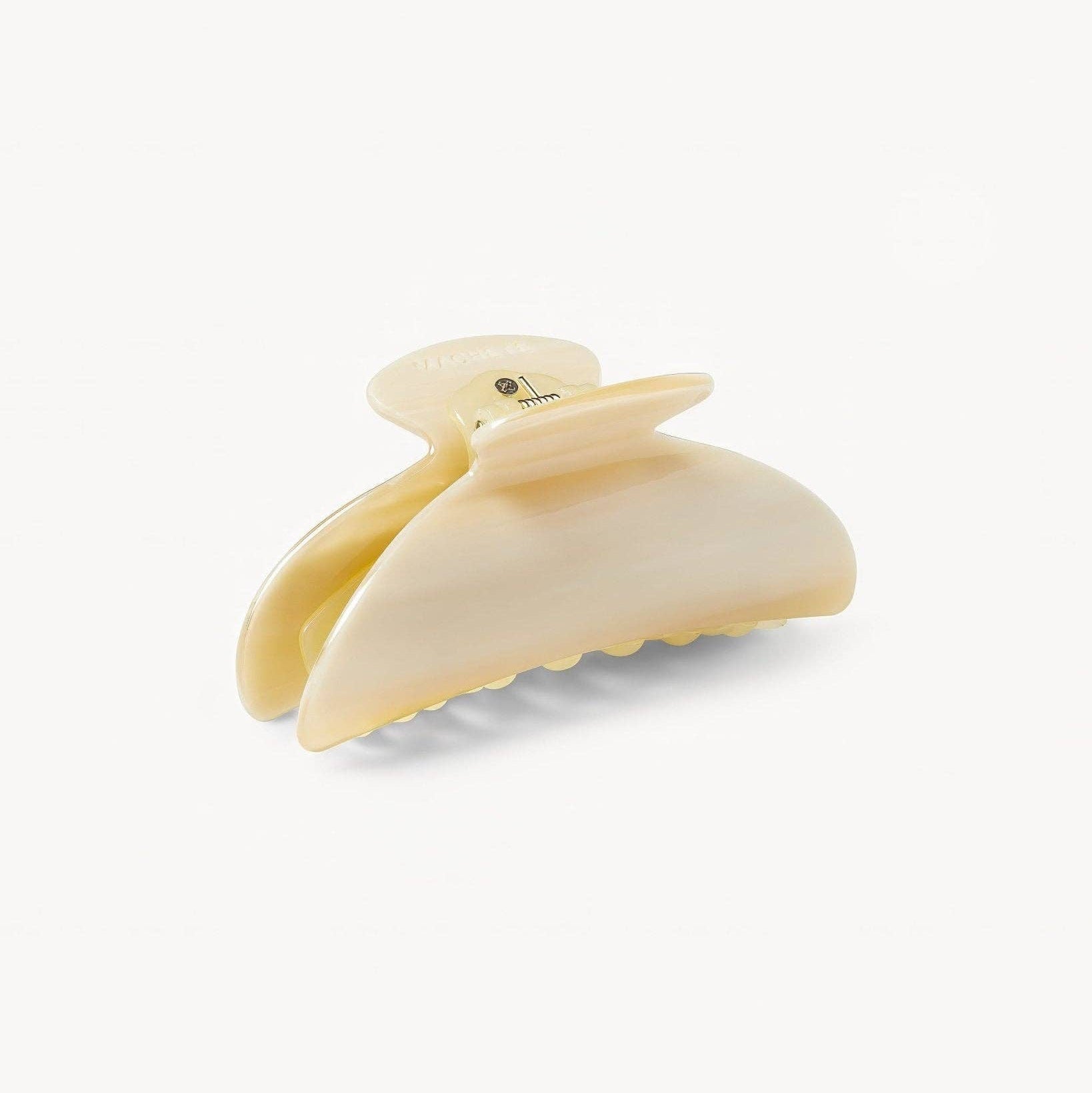 Beige hair clip on a white background