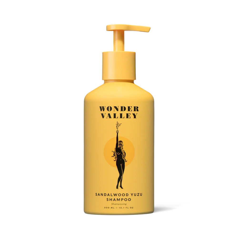 A bottle of the Sandalwood Yuzu hair shampoo, made by Wonder Valley in California