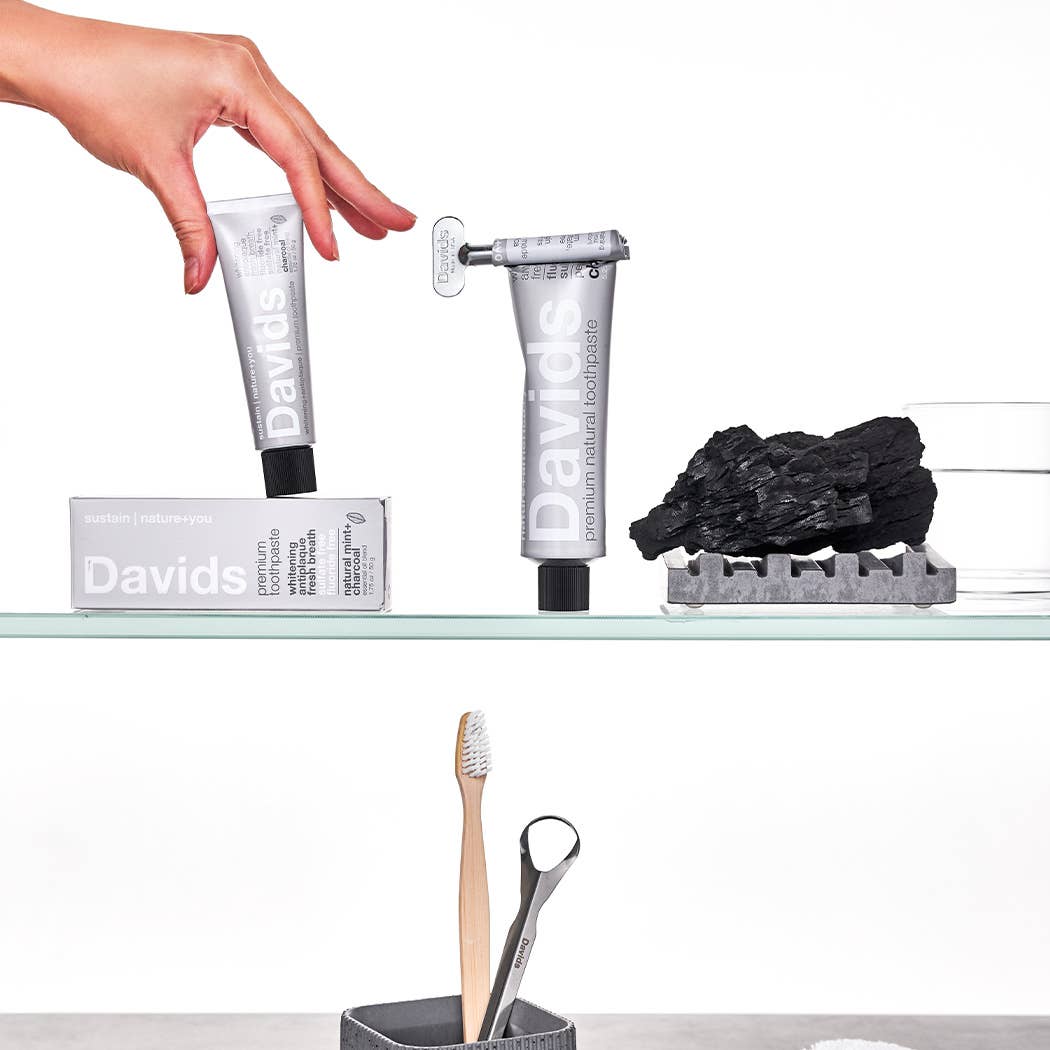 A tube of Davids Premium Natural Toothpaste with Charcoal and Peppermint flavor.
