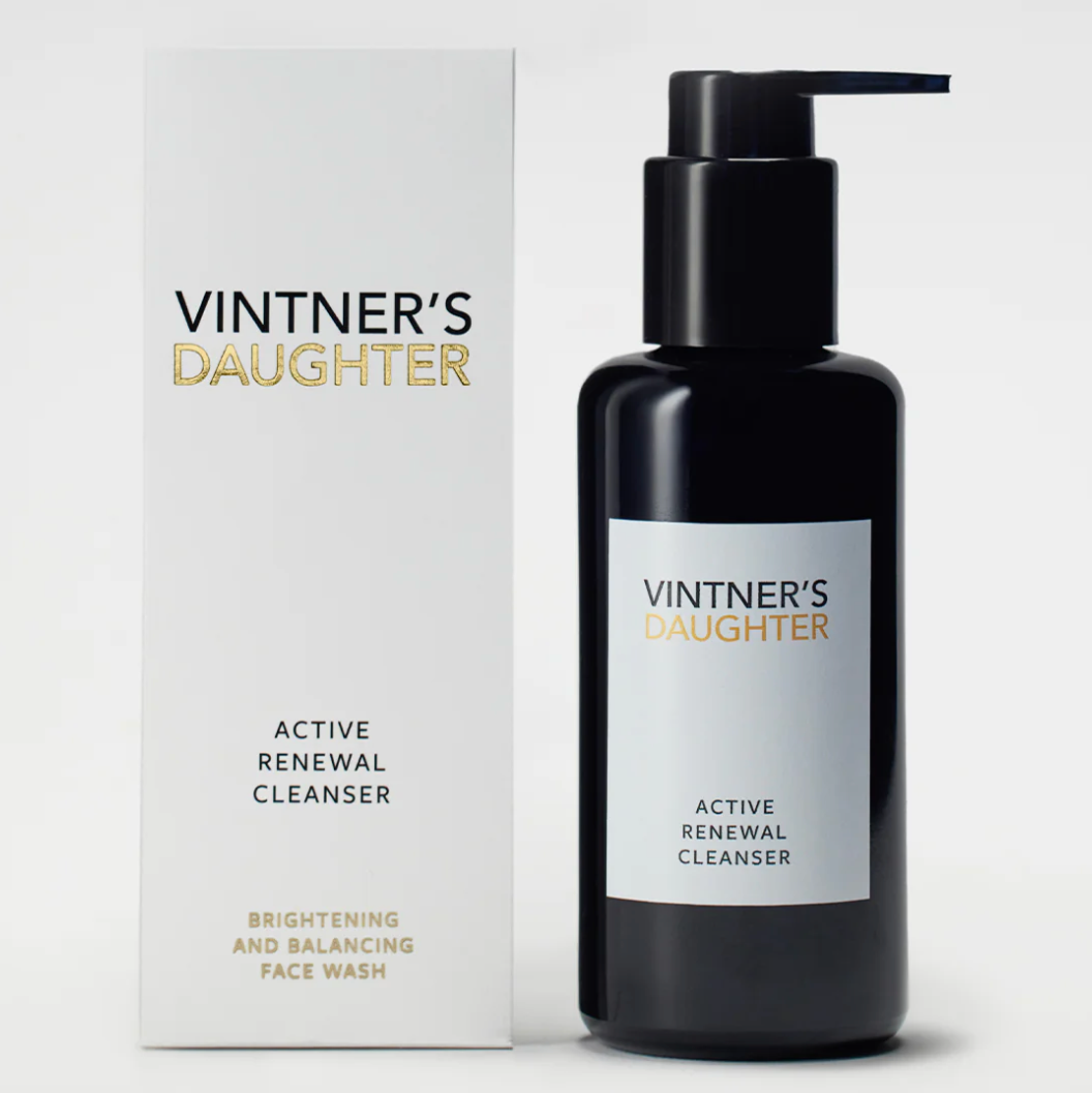 A pump bottle of Vintner's Daughter Active Renewal Cleanser, with a label that reads 'ACTIVE RENEWAL CLEANSER' and indicates a 'DOUBLE CLEANSE' process. The background is white and clean.