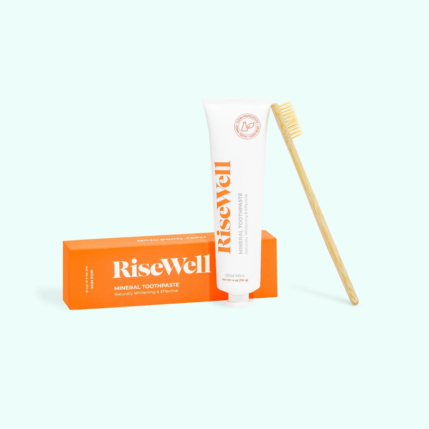 Bamboo toothbrush with 'RiseWell' branding on a white background