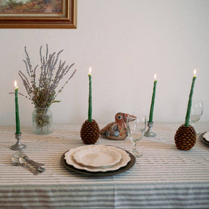 Two pairs of asparagus taper candles, made by Happy Organics in California