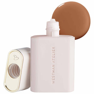 Westman Atelier complexion drops bottle with a swatch of brown shade on a white background