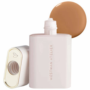 Westman Atelier complexion drops bottle with a swatch of brown shade on a white background
