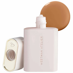 Westman Atelier complexion drops bottle with a swatch of brown shade on a white background