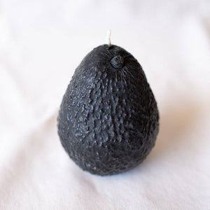 A hand-poured small-batch Avocado Candle made of 100% pure beeswax, displayed on a neutral background.