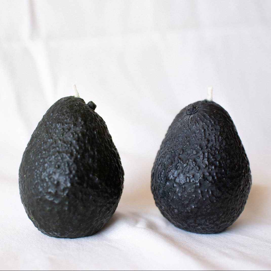 A hand-poured small-batch Avocado Candle made of 100% pure beeswax, displayed on a neutral background.