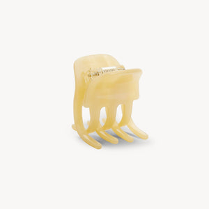 Yellow hair clip on a white background