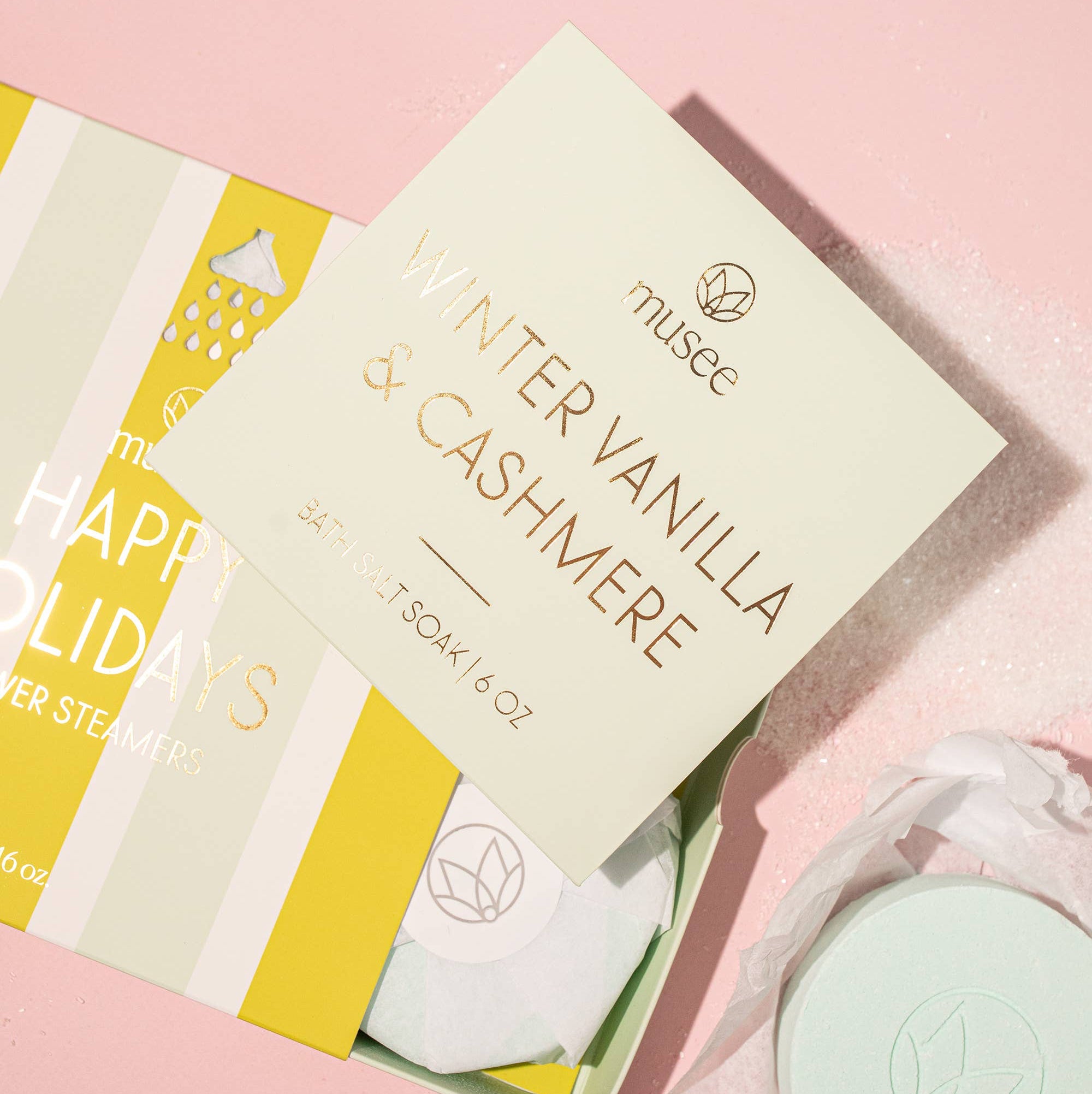 Bath salt soak packaging with 'musee' branding on a light green background