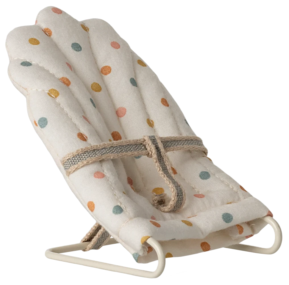 A small, multicolored dotted baby carrier with a metal frame and fabric covering, designed for toy rabbits and baby mice.