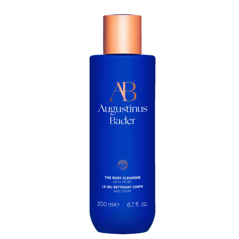 Blue bottle of Augustinus Bader body cleanser on a white background
