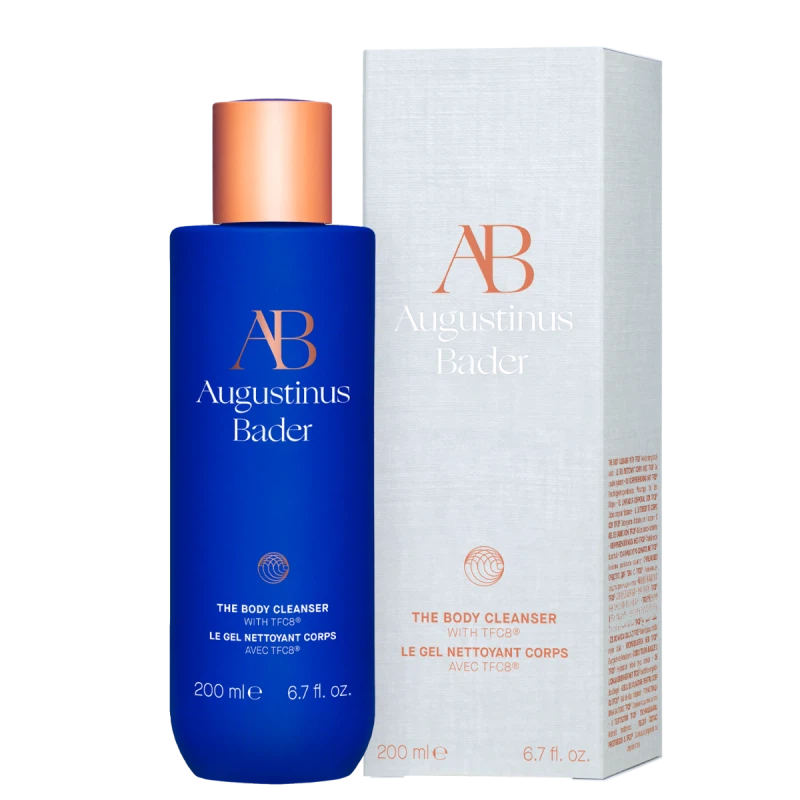 Blue bottle of Augustinus Bader body cleanser on a white background