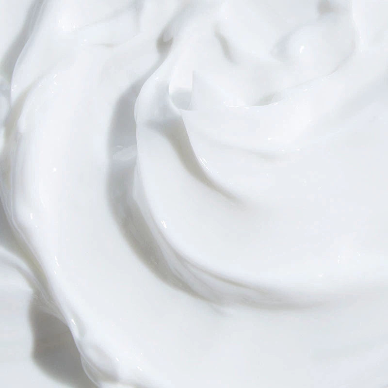 A close-up swatch of the body cream