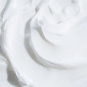 A close-up swatch of the body cream