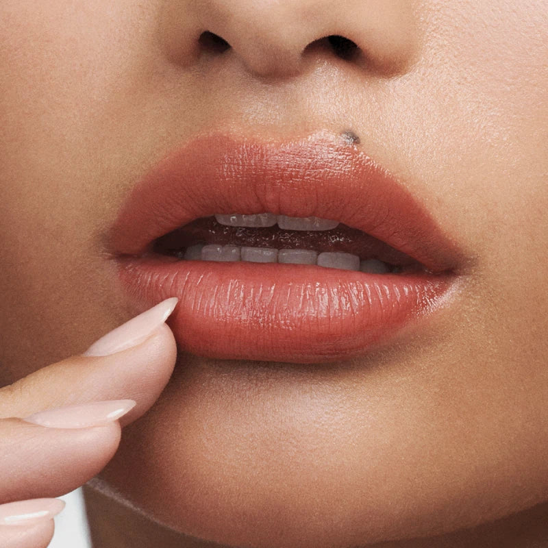 Close-up of a woman's lips with a focus on the lipstick
