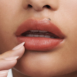 Close-up of a woman's lips with a focus on the lipstick