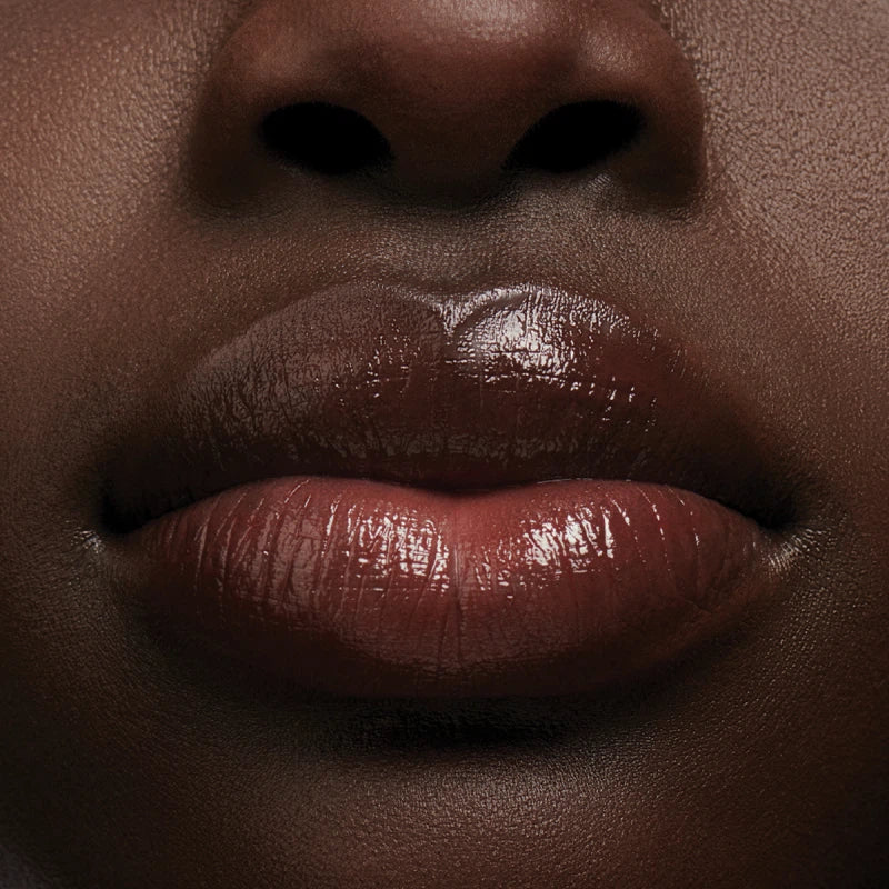 Close-up of a person's lips with a focus on texture and color.