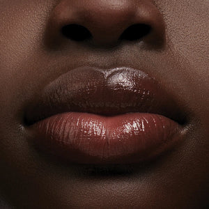 Close-up of a person's lips with a focus on texture and color.