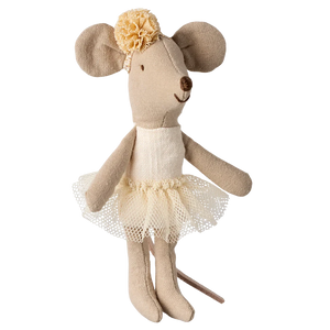 A toy mouse dressed as a ballerina with an off white colored tutu and a headband with a flower on top.
