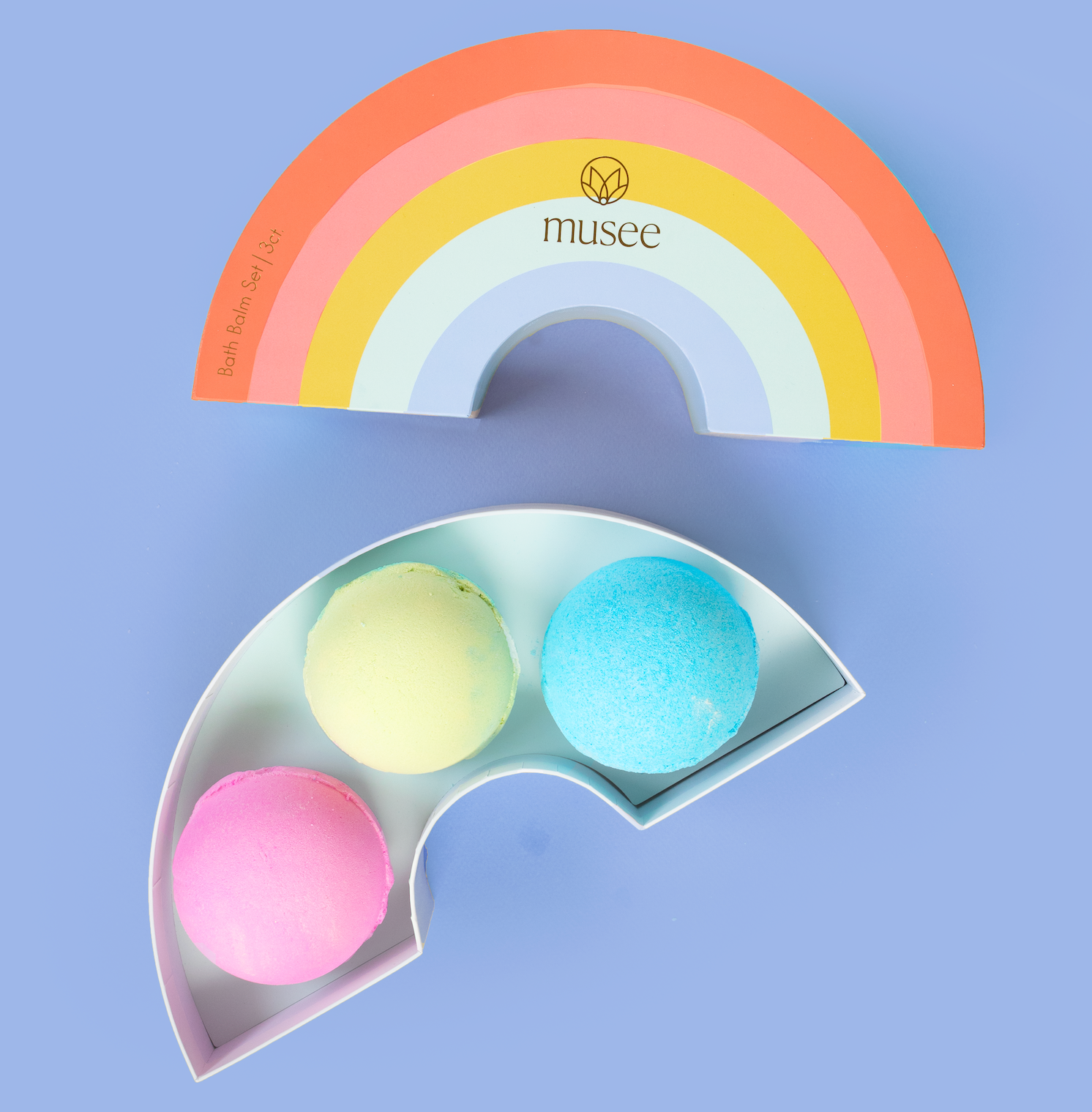 Colorful rainbow-shaped object with 'musee' branding on a white background