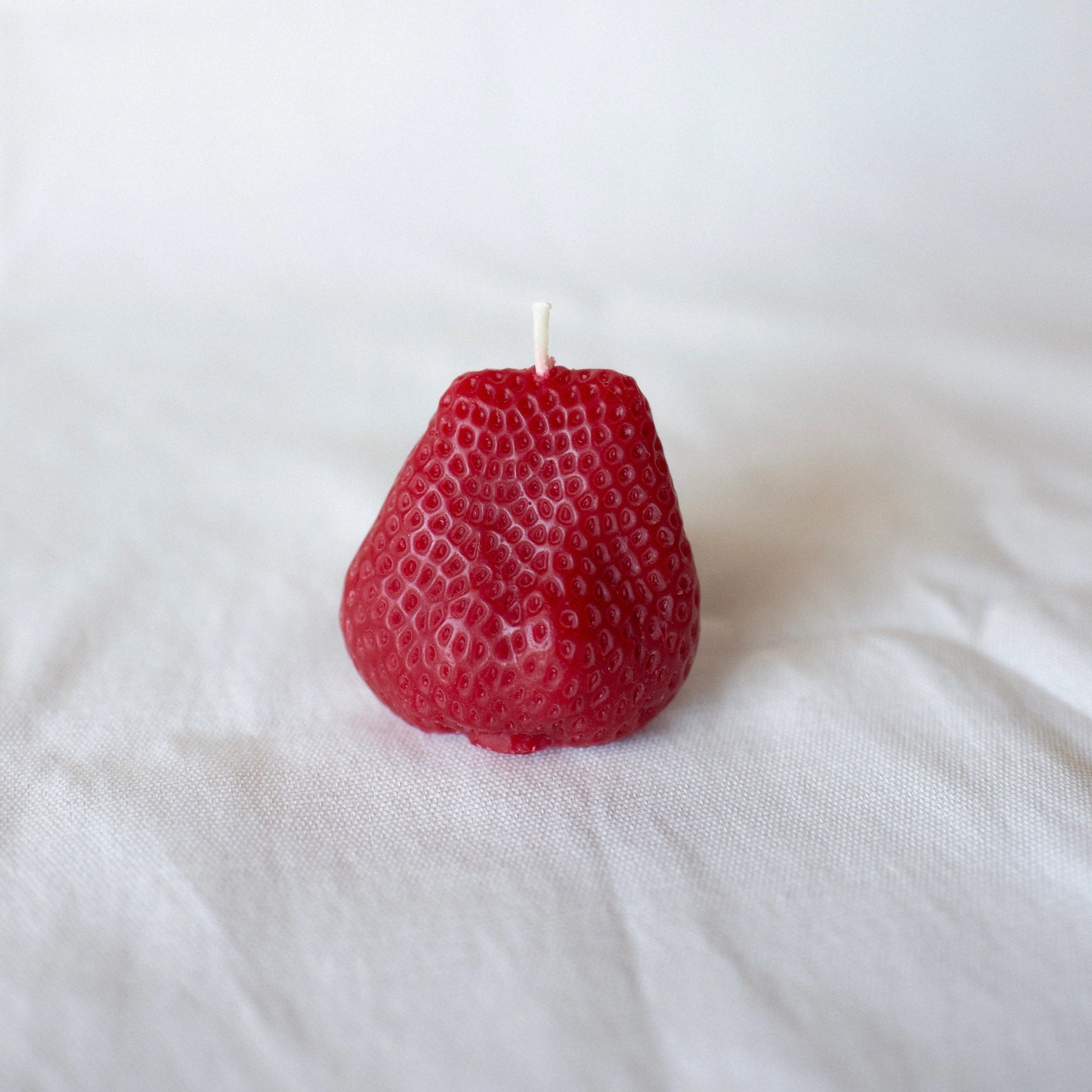 A pair of Happy Organics Beeswax Strawberries (Set of 2) 