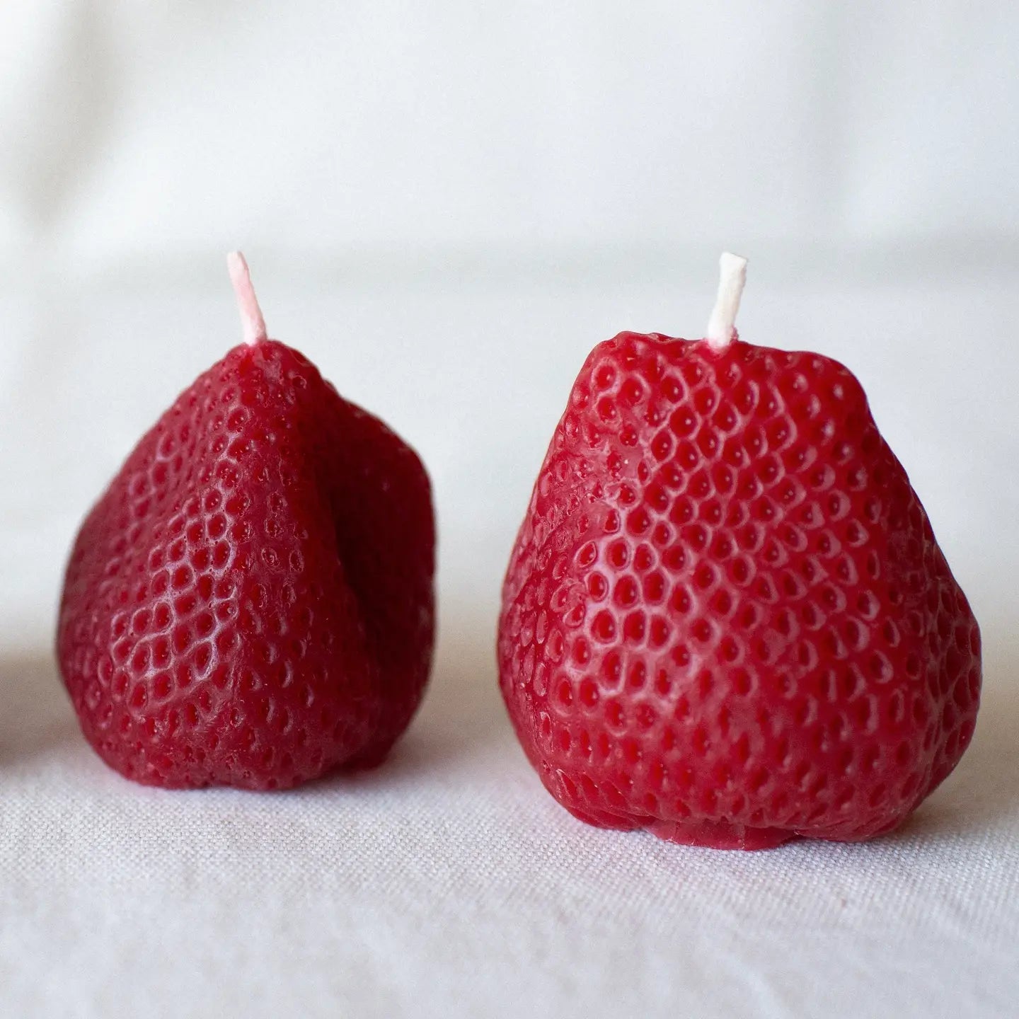 A pair of Happy Organics Beeswax Strawberries (Set of 2) 