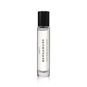 A rollerball of Heretic Bergamusk perfume, with a black cap. 