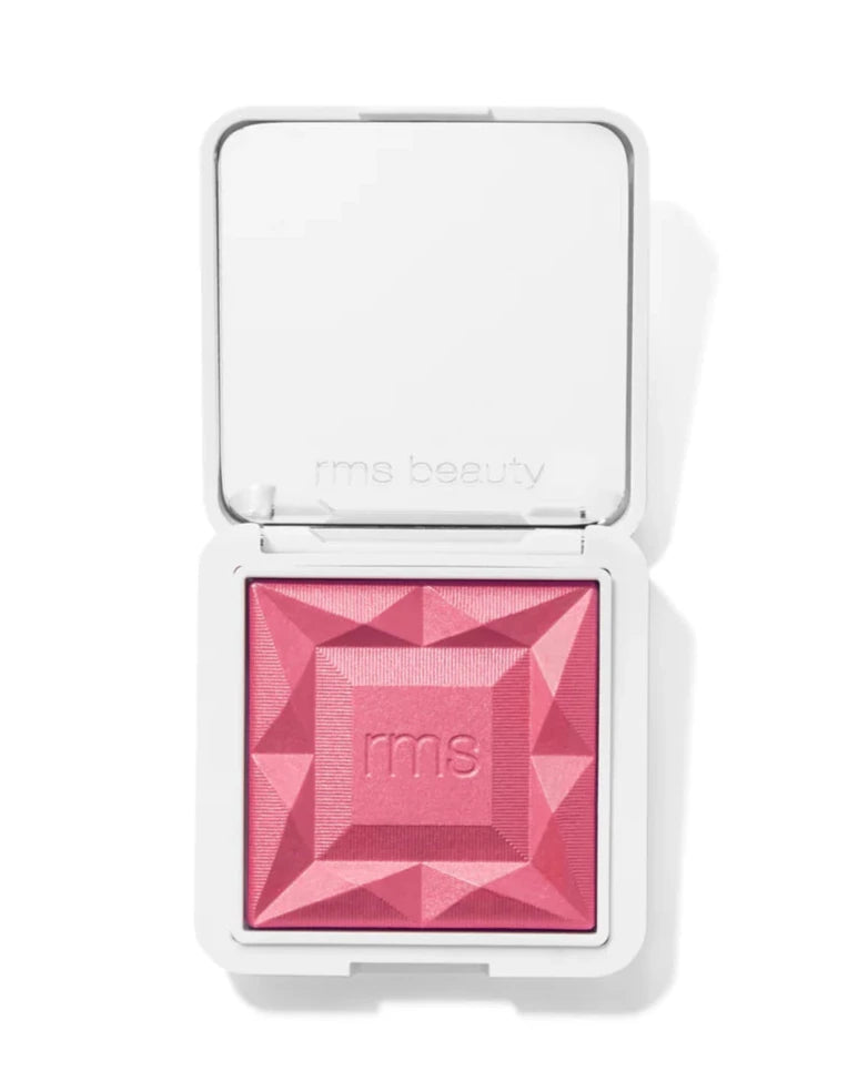 Pink blush in a compact case on a white background