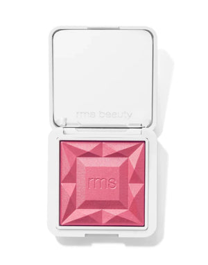 Pink blush in a compact case on a white background
