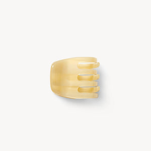 Gold ring with a textured design on a white background