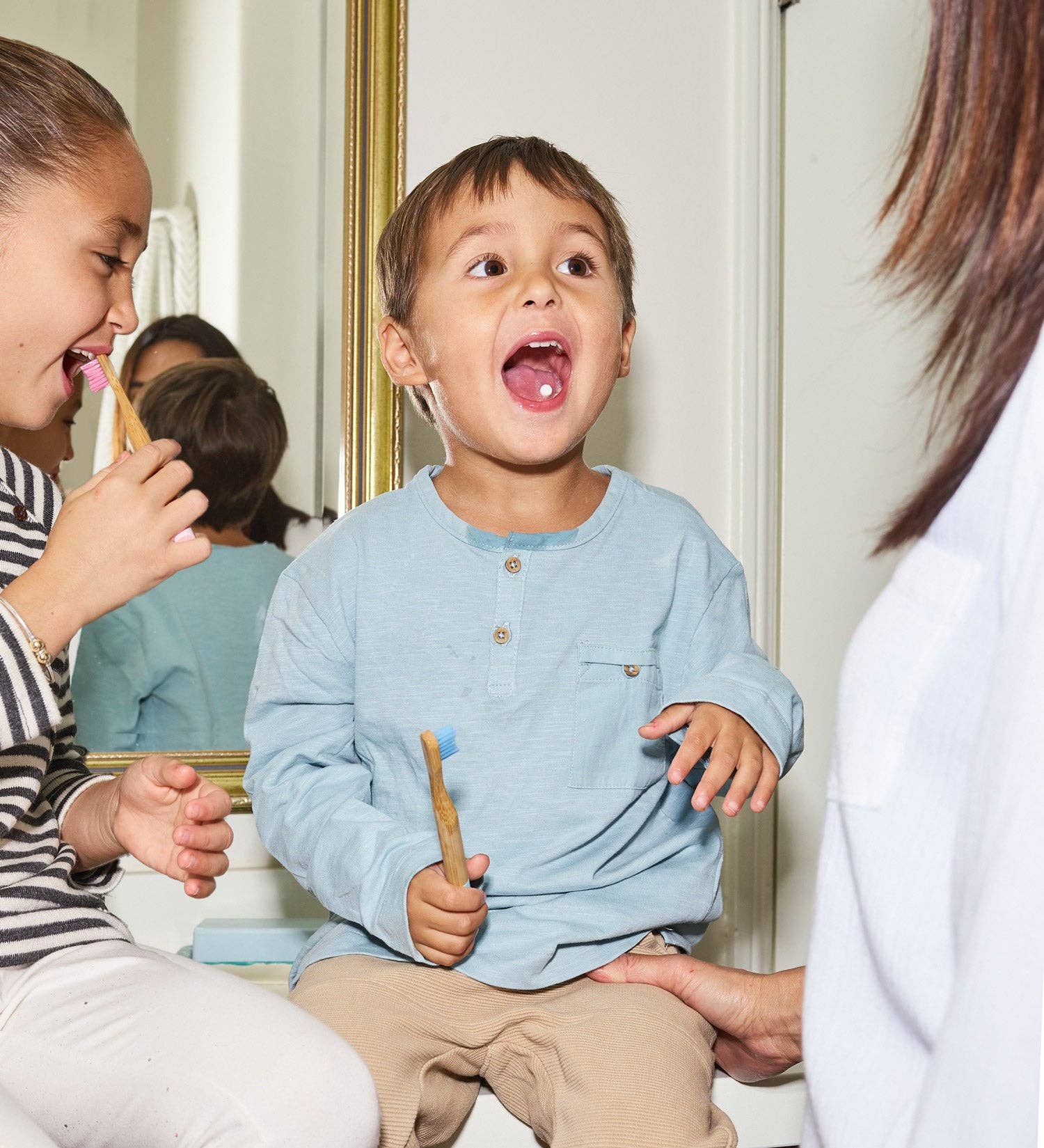 A child with a bite toothpaste tablet in his mouth. 