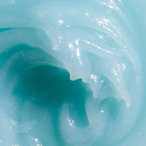 Close-up of a blue gelatinous substance with a glossy surface.