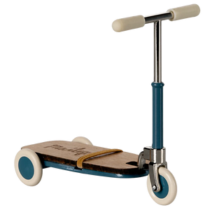 Children's scooter with blue frame and beige wheels on a white background