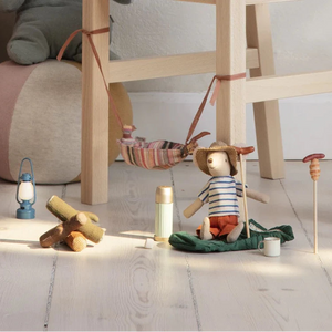 Children's toys and accessories on a light wooden floor