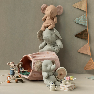 Children's toys and plushies on a neutral background