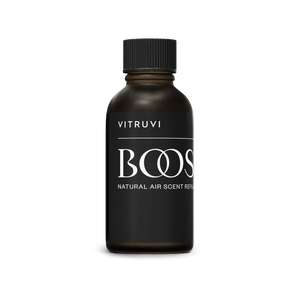 Black bottle of Vitruvi Boost natural air scent refresher on a white background