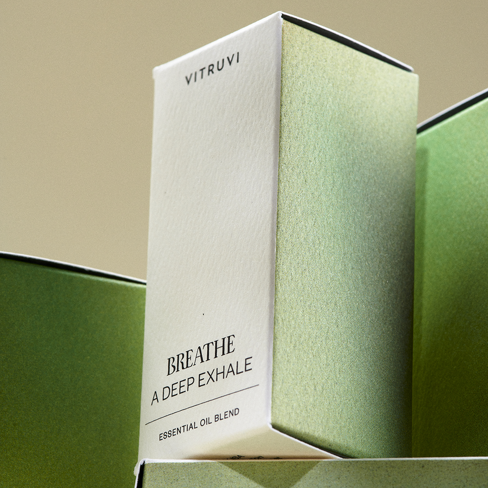 Vitruvi Breathe essential oil blend packaging with green and white design.