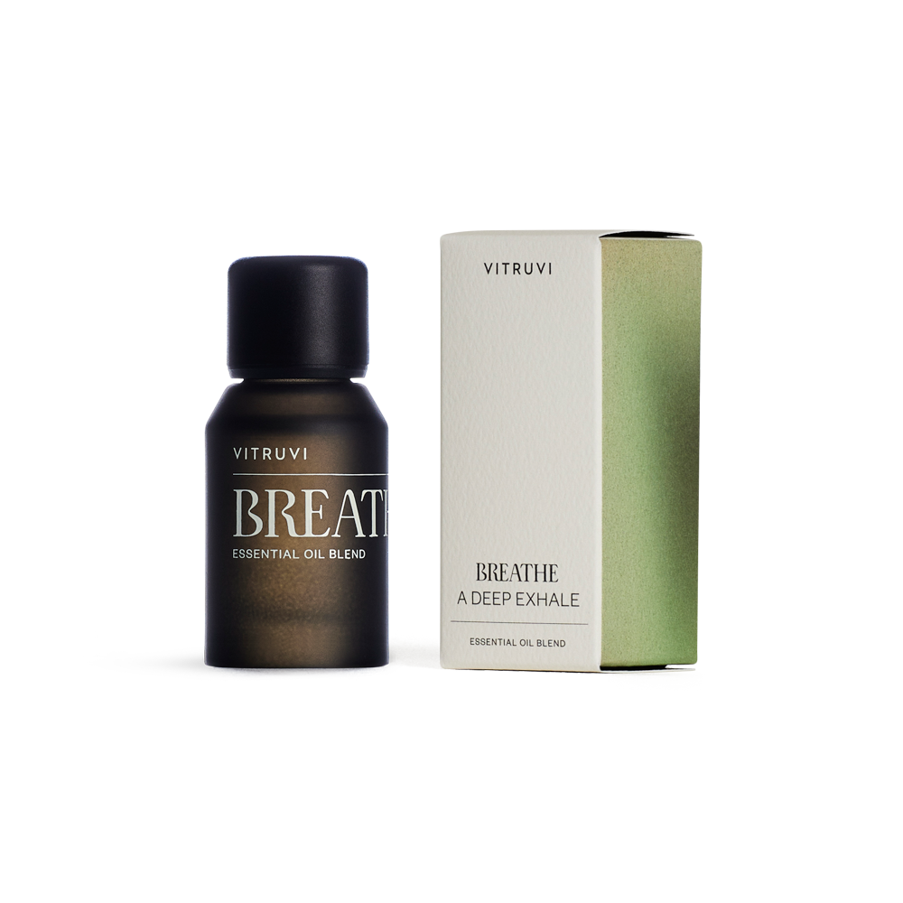 Vitruvi Breathe essential oil blend bottle on a transparent background