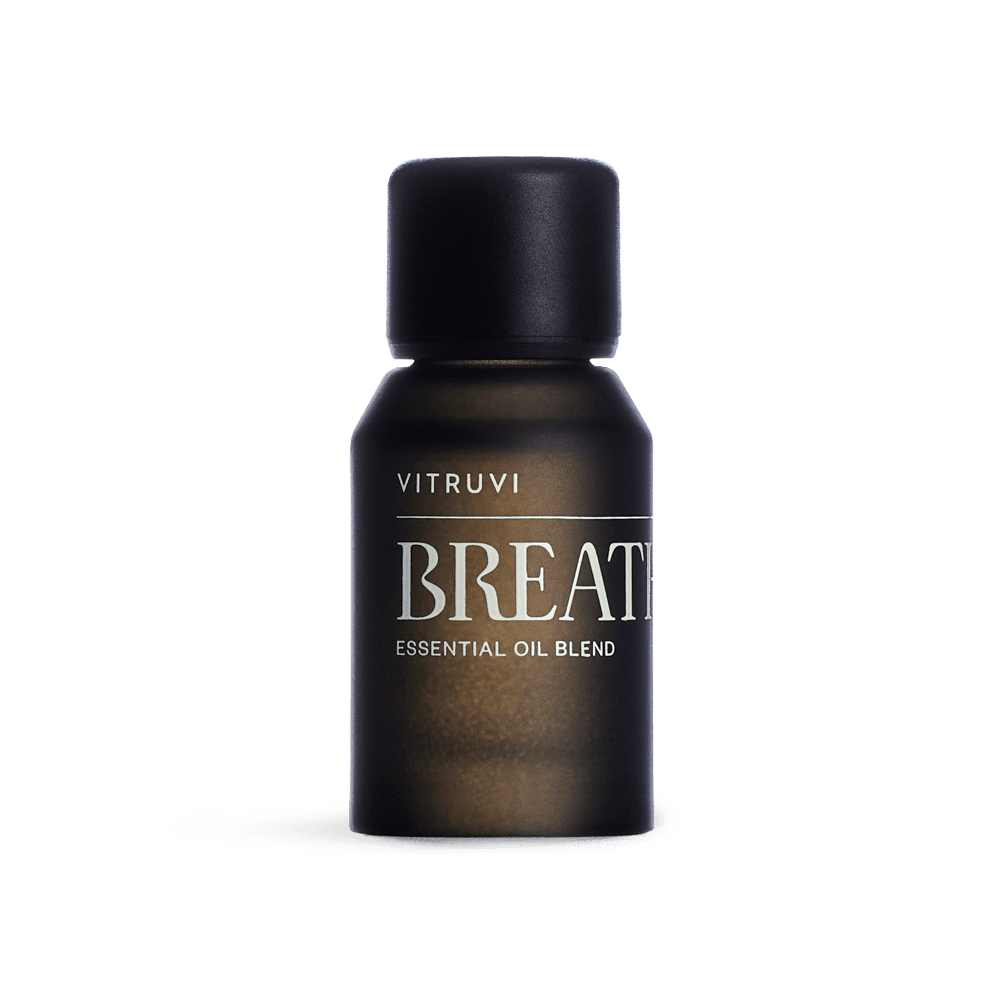 Vitruvi Breathe essential oil blend bottle on a transparent background