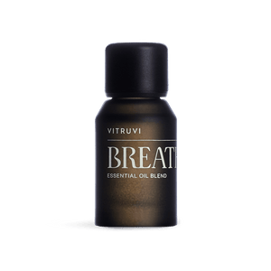Vitruvi Breathe essential oil blend bottle on a transparent background